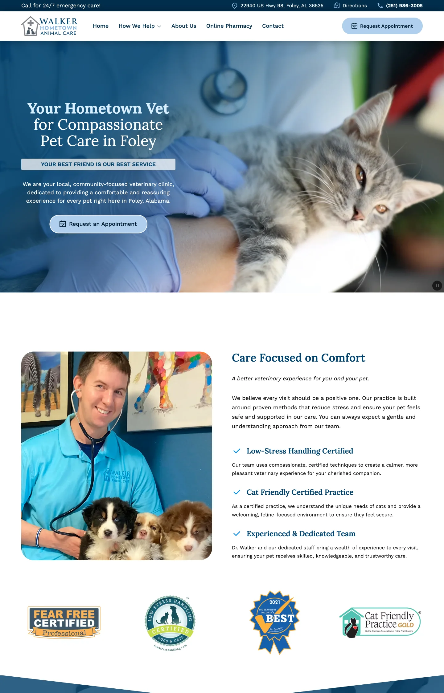 A complete website screenshot for a veterinary clinic using blue and white. It features images of a cat being examined and a smiling veterinarian holding three puppies.